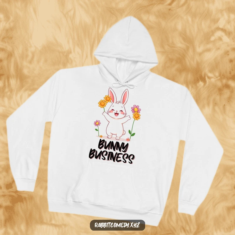 Funny hoodie featuring a content rabbit character playfully juggling three vibrantly colored wildflowers, perfect for casual wear.