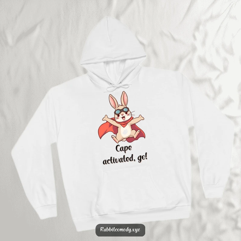Funny rabbit wearing a hoodie and superhero cape, leaping dynamically, a cozy and funny gift for heroes.