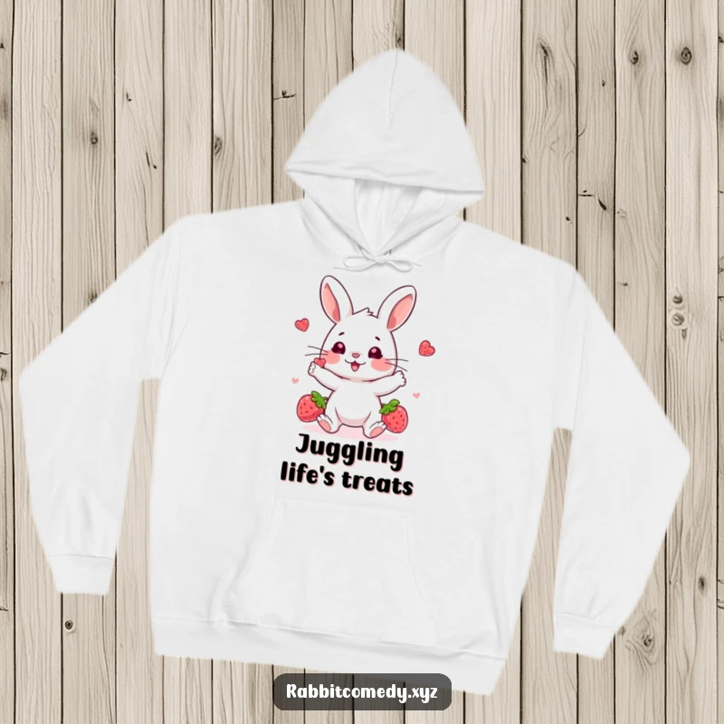 Funny hooded sweatshirt, a playful rabbit character juggling bright berries with a happy, concentrated expression, ideal for cozy humor.