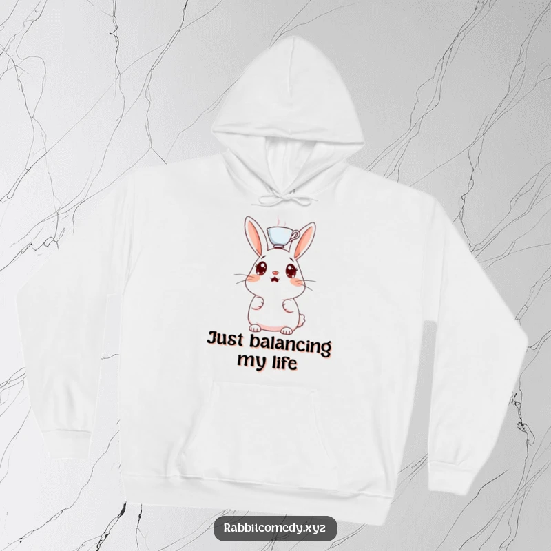 Funny hooded sweatshirt, a surprised rabbit character with a teacup balanced on its head, an amusing and comfortable design.
