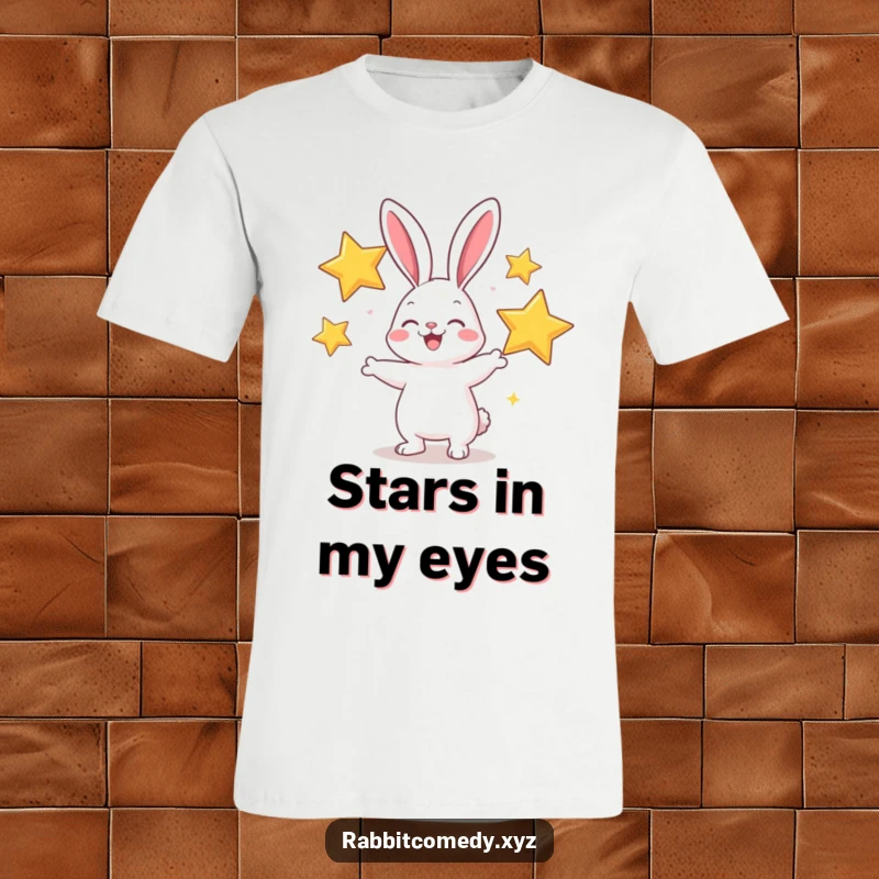 Funny t-shirt depicting a cheerful rabbit character joyfully juggling three oversized, sparkly stars.