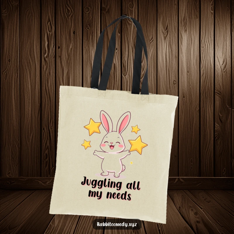 Funny tote bag showing a cheerful rabbit character juggling big, sparkly stars, perfect for carrying everyday items.